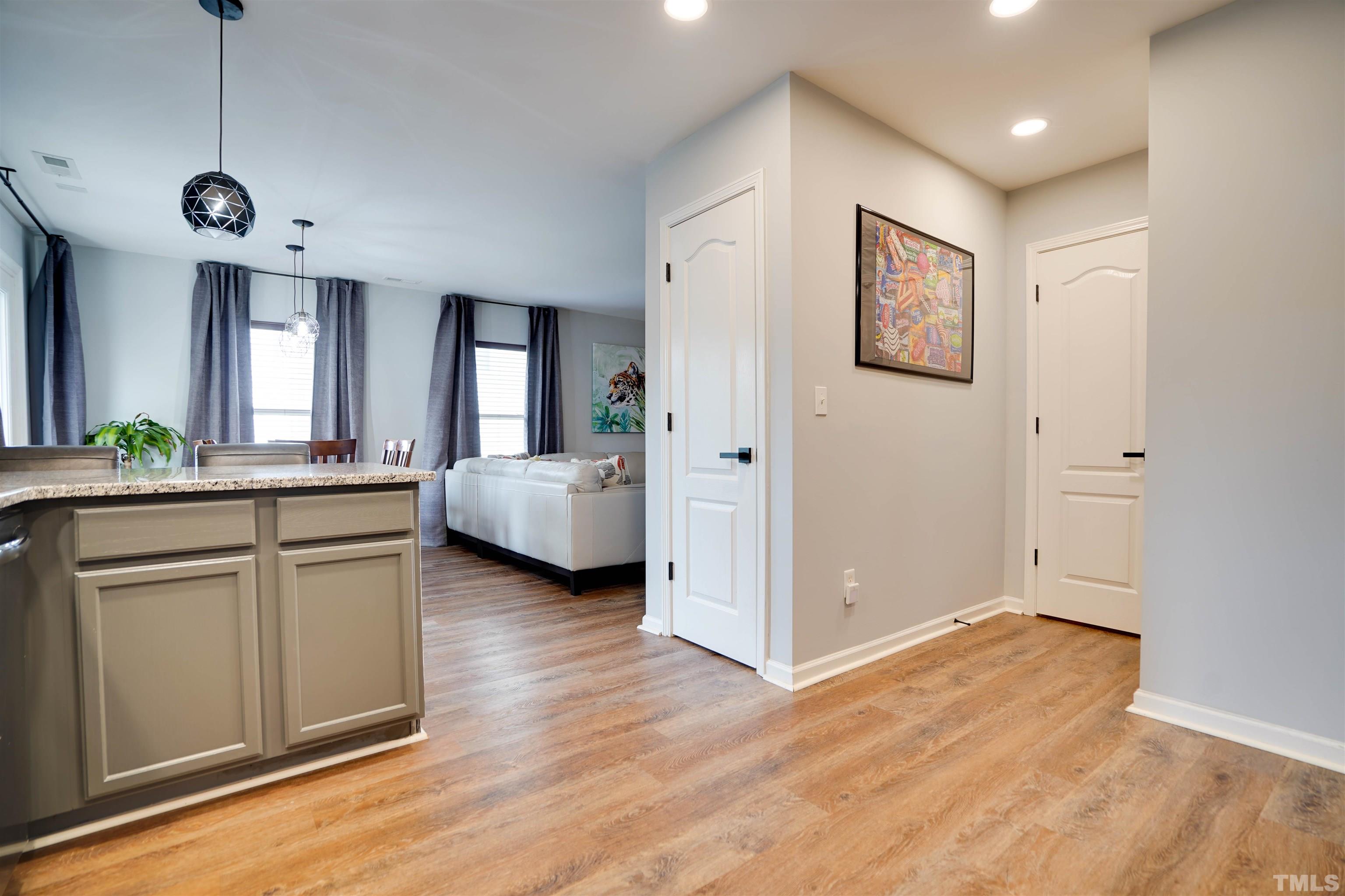 3626 Willano Way Raleigh, NC 27610 - Photo 9 of 20 a view of a kitchen with a refrigerator and a sink