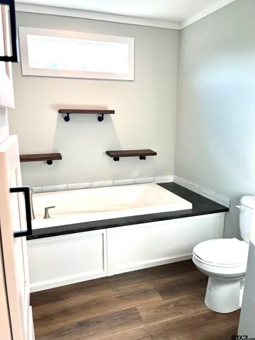 a bathroom with a toilet and a sink