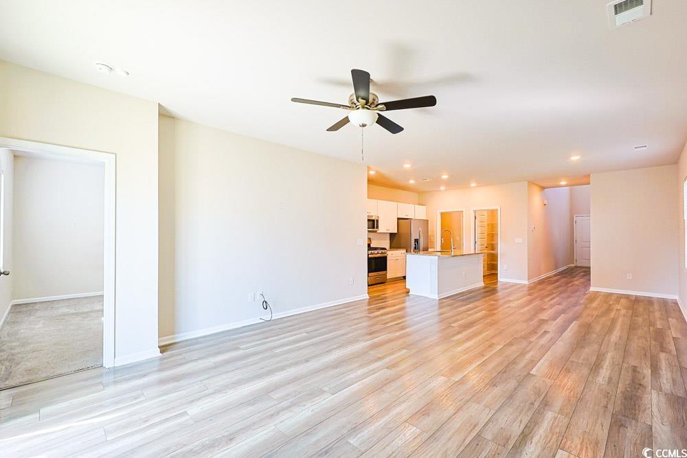 1560 Swing Bridge Way Myrtle Beach, SC 29588 - Photo 3 of 35 Unfurnished living room with a ceiling fan, recessed lighting, and light wood finished floors