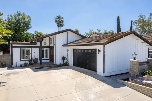 a front view of a house with garage
