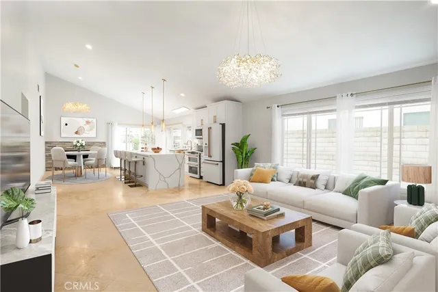 a living room with furniture potted plant and a large window