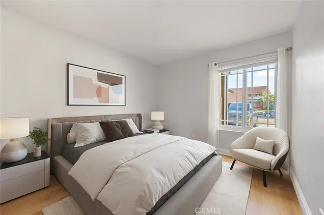 a bedroom with bed and a couch