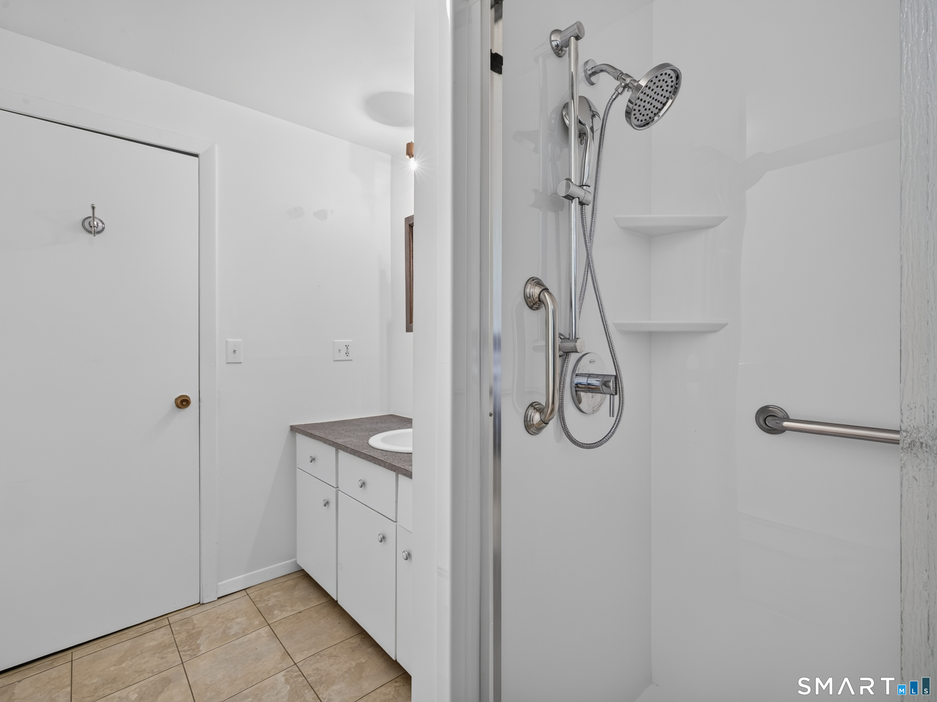 75 Airline Road Clinton, CT 06413 - Photo 26 of 37 a bathroom with a granite countertop shower curtain and a sink