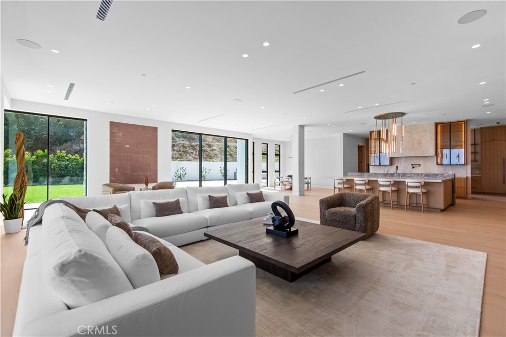 5340 Whitman Road Hidden Hills, CA 91302 - Photo 11 of 57 a living room with furniture and a large window