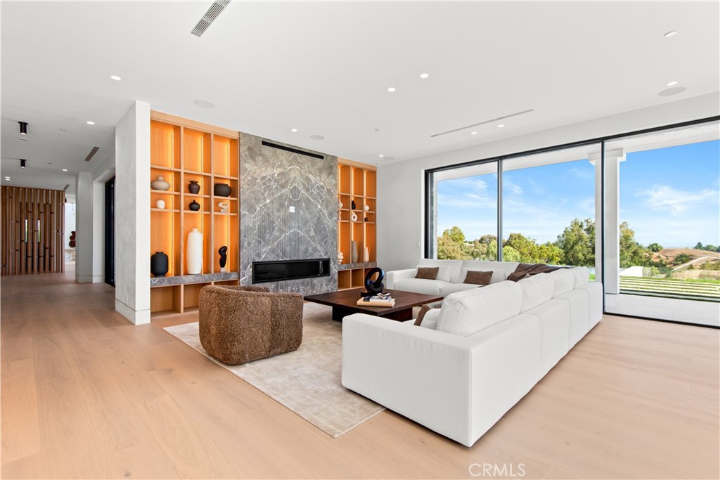 5340 Whitman Road Hidden Hills, CA 91302 - Photo 12 of 57 a living room with furniture large window and outer view
