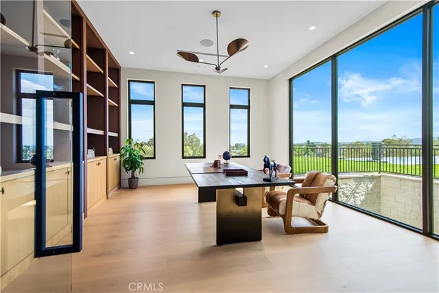 a living room with furniture and a large mirror