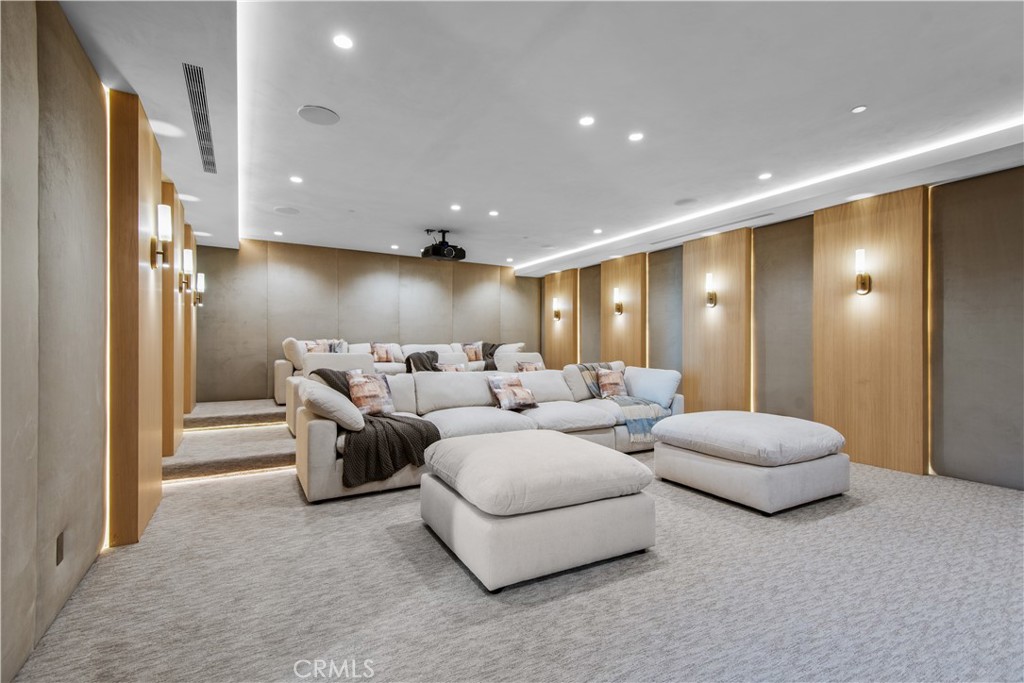 5340 Whitman Road Hidden Hills, CA 91302 - Photo 15 of 57 a living room with furniture and a large mirror