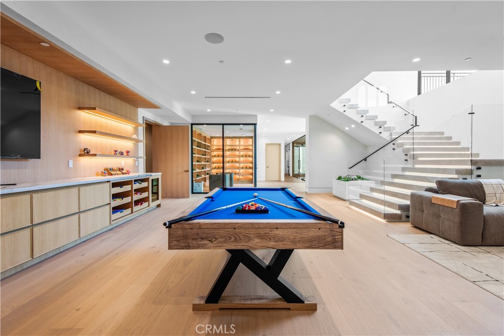 5340 Whitman Road Hidden Hills, CA 91302 - Photo 16 of 57 a kitchen with stainless steel appliances kitchen island granite countertop a sink dishwasher stove and white cabinets with wooden floor