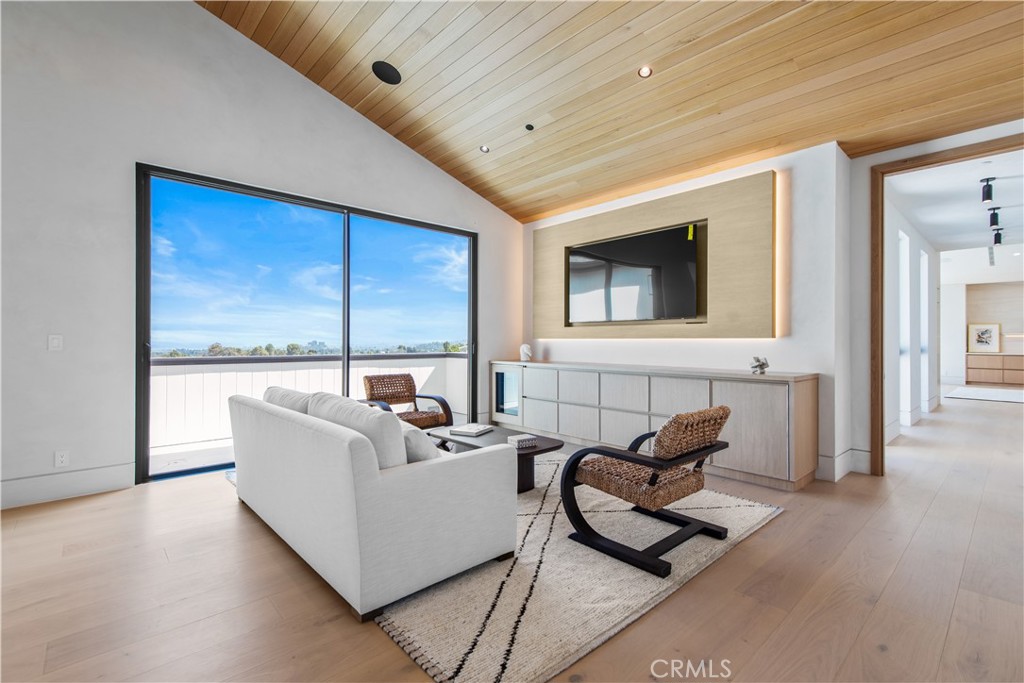 5340 Whitman Road Hidden Hills, CA 91302 - Photo 21 of 57 a living room with furniture and a large window