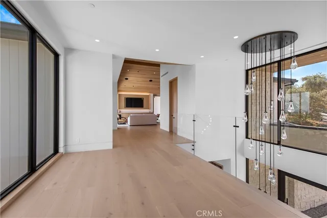 a bedroom with a large bed and a large window