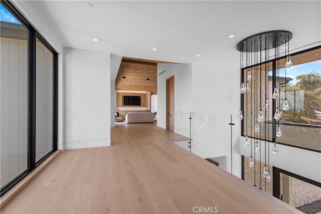 5340 Whitman Road Hidden Hills, CA 91302 - Photo 21 of 57 a view of a hallway with a kitchen