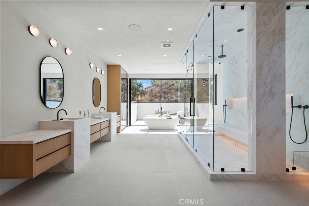5340 Whitman Road Hidden Hills, CA 91302 - Photo 27 of 57 a large bathroom with a double vanity sink a mirror and a bathtub