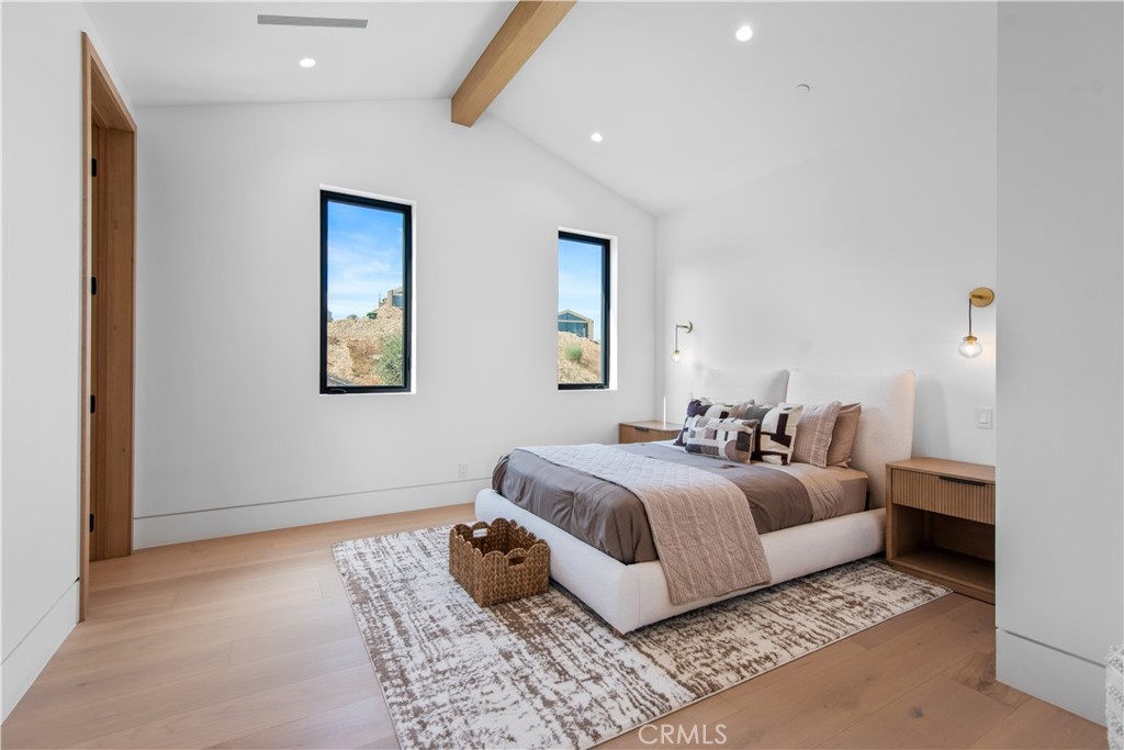 5340 Whitman Road Hidden Hills, CA 91302 - Photo 30 of 57 a bedroom with a large bed and a couch