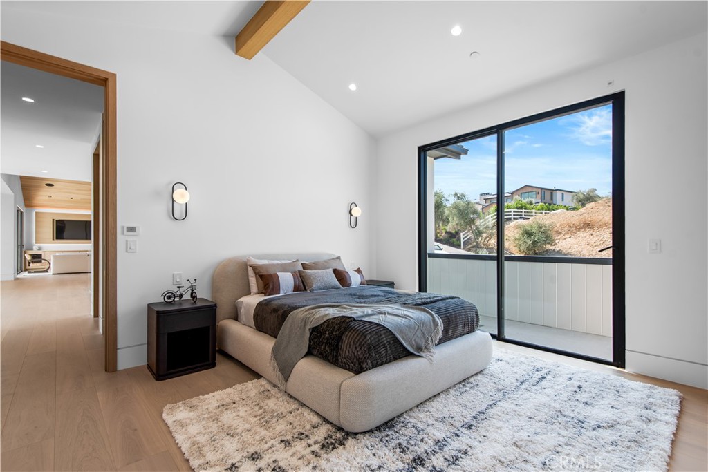 5340 Whitman Road Hidden Hills, CA 91302 - Photo 32 of 57 a bedroom with a large bed and a window