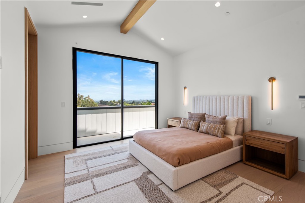 5340 Whitman Road Hidden Hills, CA 91302 - Photo 33 of 57 a bedroom with a large bed and a large window