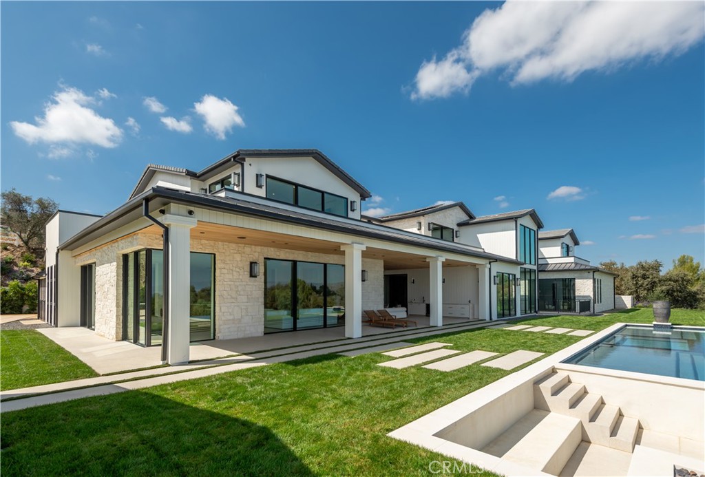 5340 Whitman Road Hidden Hills, CA 91302 - Photo 38 of 57 a front view of a house with a yard