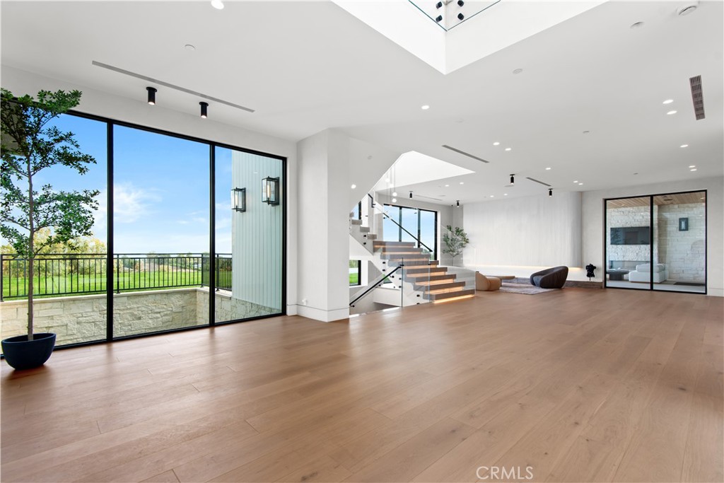 5340 Whitman Road Hidden Hills, CA 91302 - Photo 4 of 57 an empty room with sliding glass door and furniture