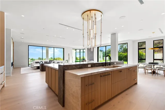 a large kitchen with a table and chairs