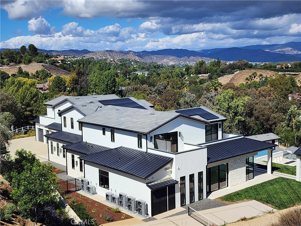 5340 Whitman Road Hidden Hills, CA 91302 - Photo 52 of 57 front view of a house with a yard
