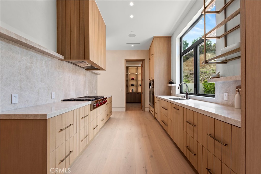 5340 Whitman Road Hidden Hills, CA 91302 - Photo 7 of 57 a large kitchen with stainless steel appliances granite countertop a lot of counter space and a sink