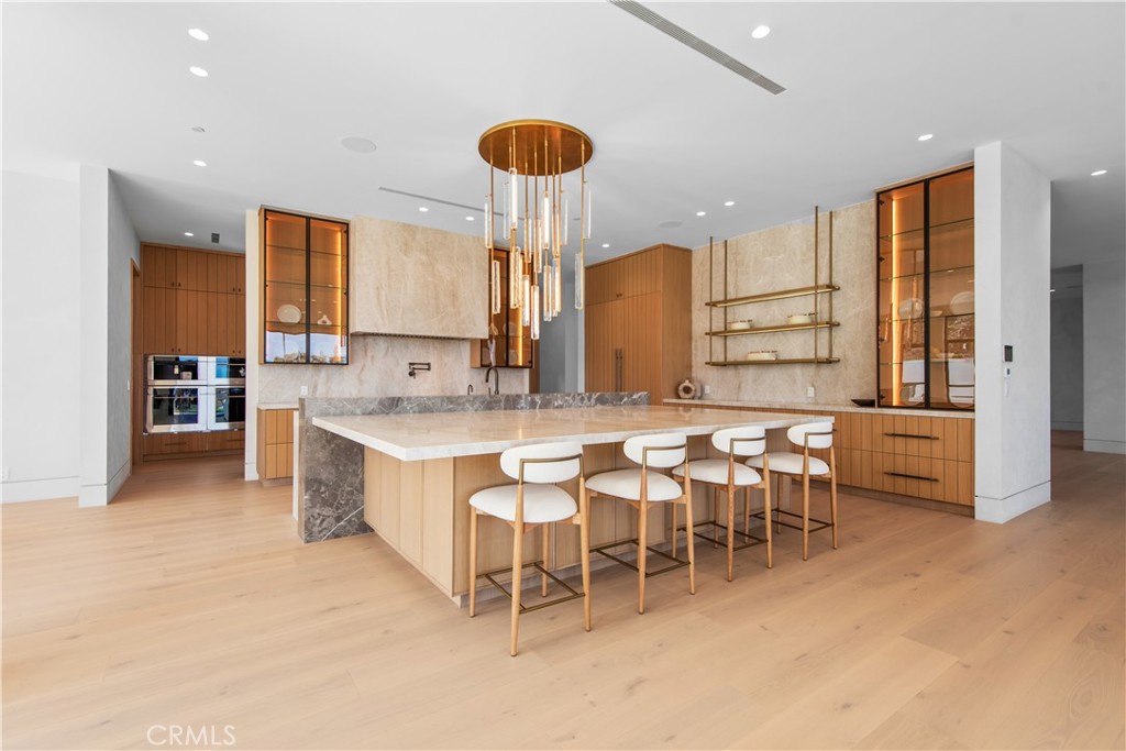 5340 Whitman Road Hidden Hills, CA 91302 - Photo 7 of 57 a large kitchen with a table and chairs