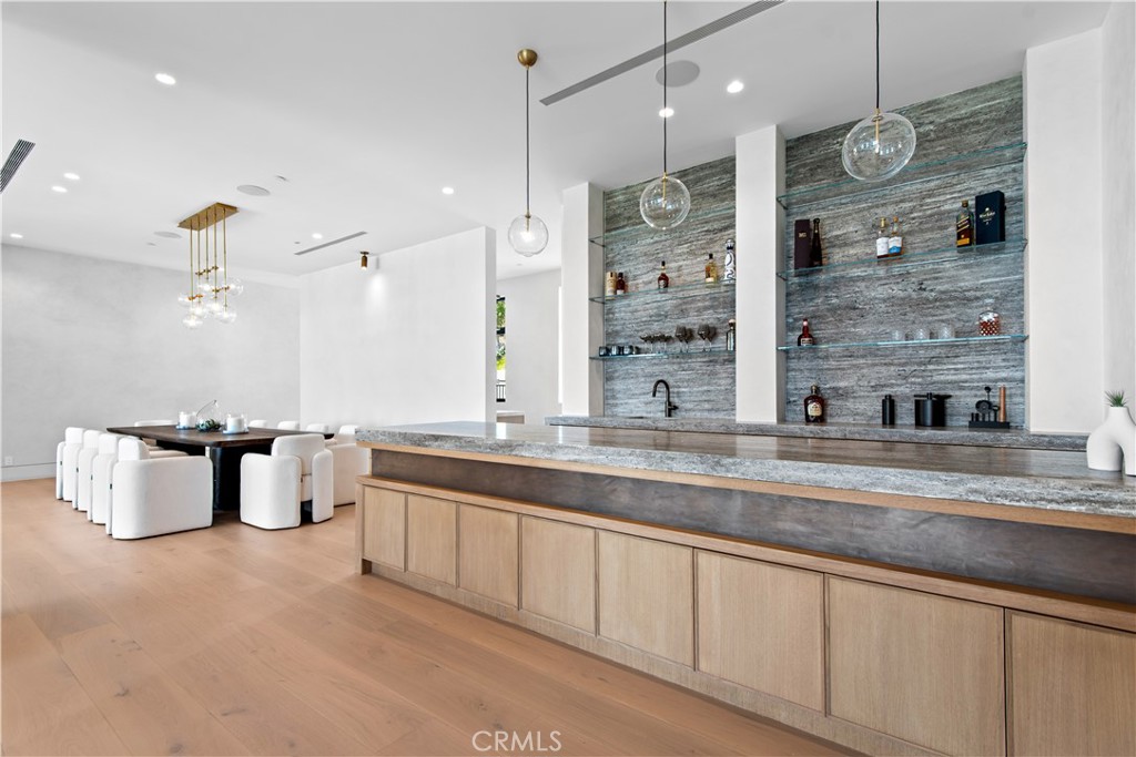 5340 Whitman Road Hidden Hills, CA 91302 - Photo 8 of 57 a large kitchen with granite countertop a sink and a refrigerator