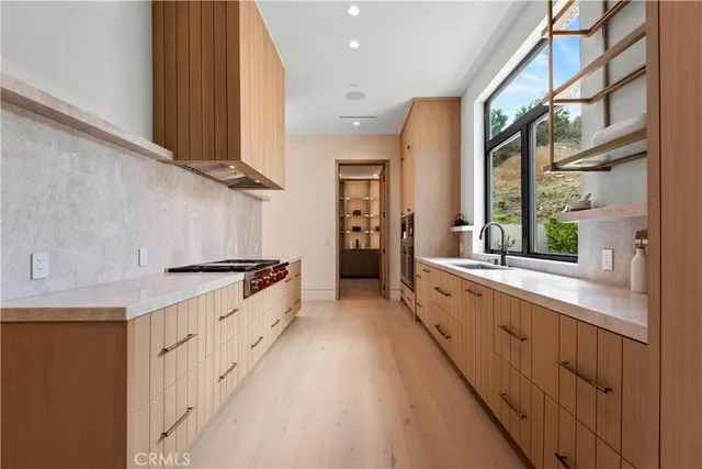 a view of a dining room with furniture wooden floor and chandelier