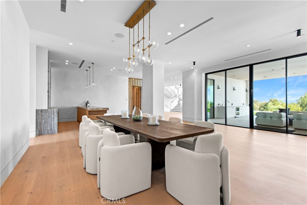 5340 Whitman Road Hidden Hills, CA 91302 - Photo 10 of 57 a view of a dining room with furniture wooden floor and chandelier