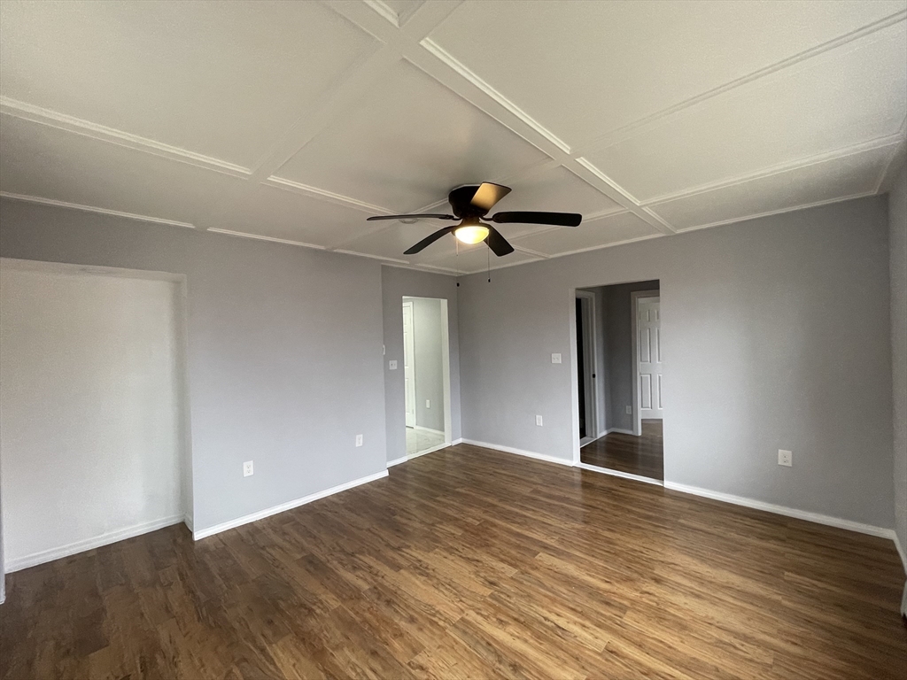 59 High Street Warren, MA 01083 - Photo 15 of 42 a view of an empty room with wooden floor and a ceiling fan