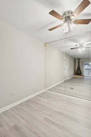 a kitchen with white cabinets and appliances