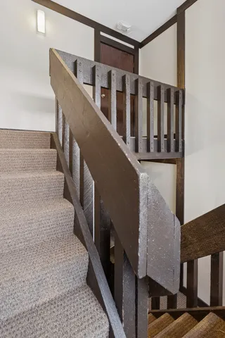 a utility room with dryer washer and a view of kitchen