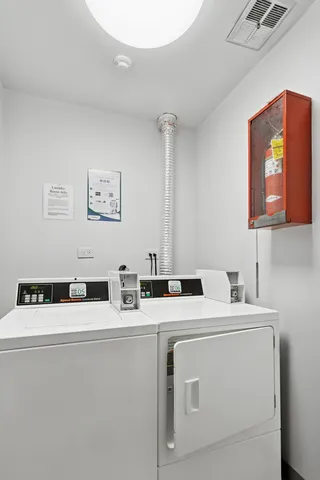 a view of a house with yard and sitting area