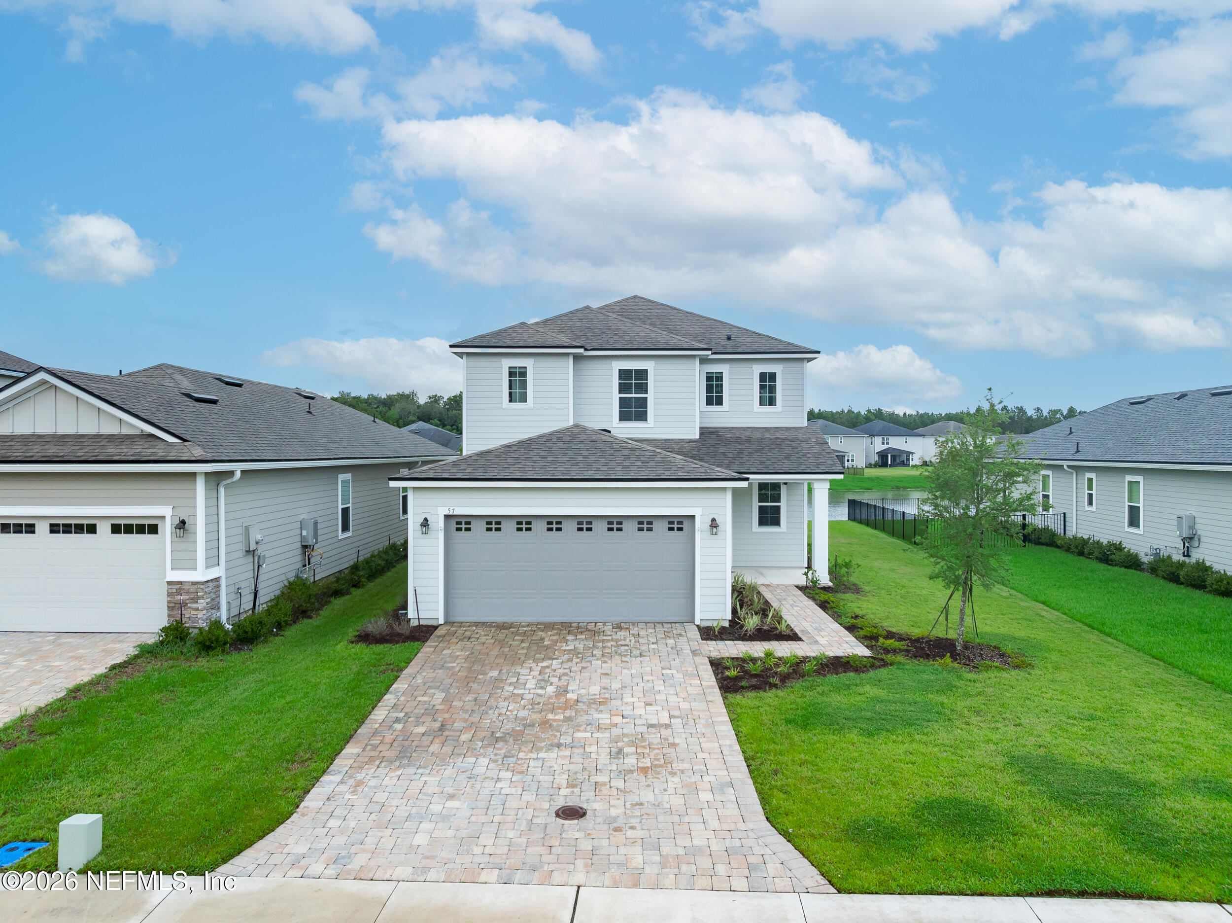 57 Cedar Elm Way St. Augustine, FL 32092 - Photo 44 of 65 a front view of house with yard and entertaining space