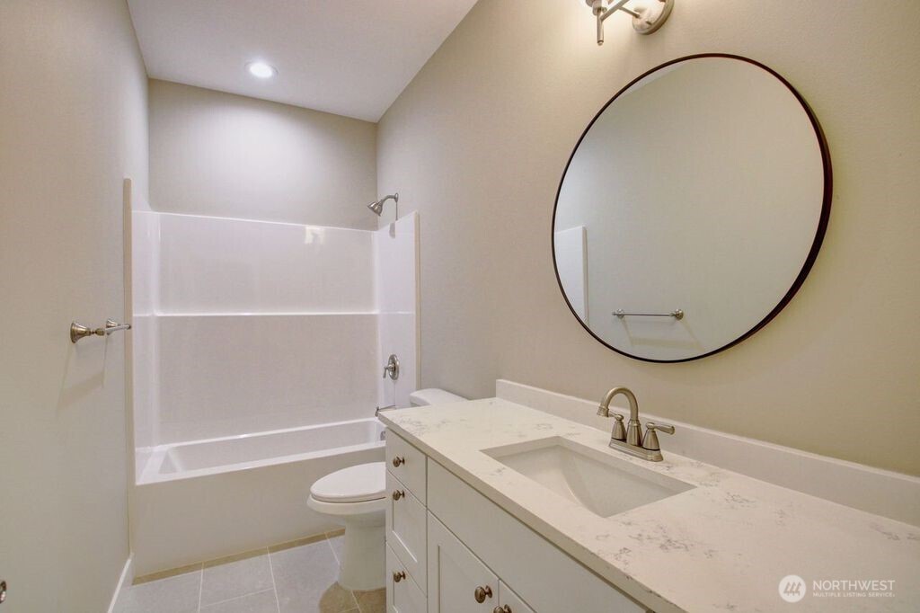8583 Trillium Lane Concrete, WA 98237 - Photo 14 of 34 a bathroom with a sink a toilet and a mirror