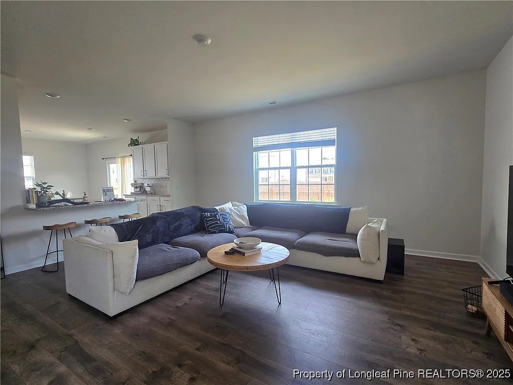 2153 Clydesmill Road Fayetteville, NC 28314 - Photo 11 of 16 a living room with furniture and a wooden floor