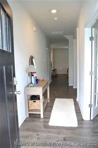 a living room with furniture and a rug