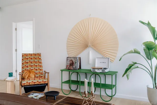 a view of balcony with two chairs and a potted plant