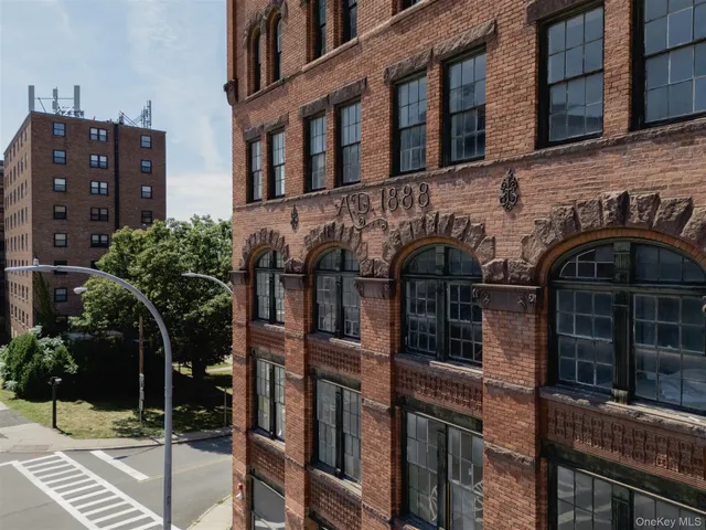 a front view of a building with street view