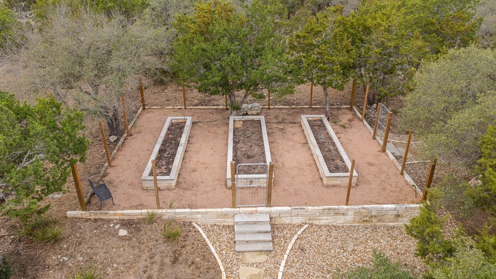 4018 Bee Creek Road Spicewood, TX 78669 - Photo 15 of 40 Aerial view highlighting raised, fully fenced garden beds.