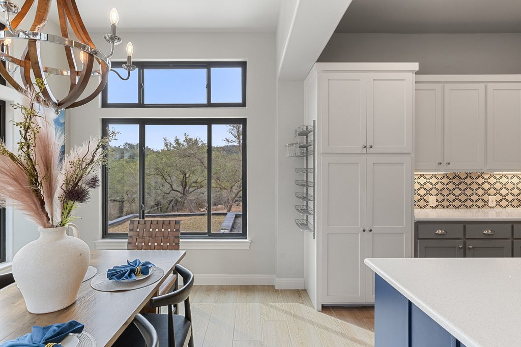 4018 Bee Creek Road Spicewood, TX 78669 - Photo 26 of 40 Open dining and kitchen areas ideal for entertaining.