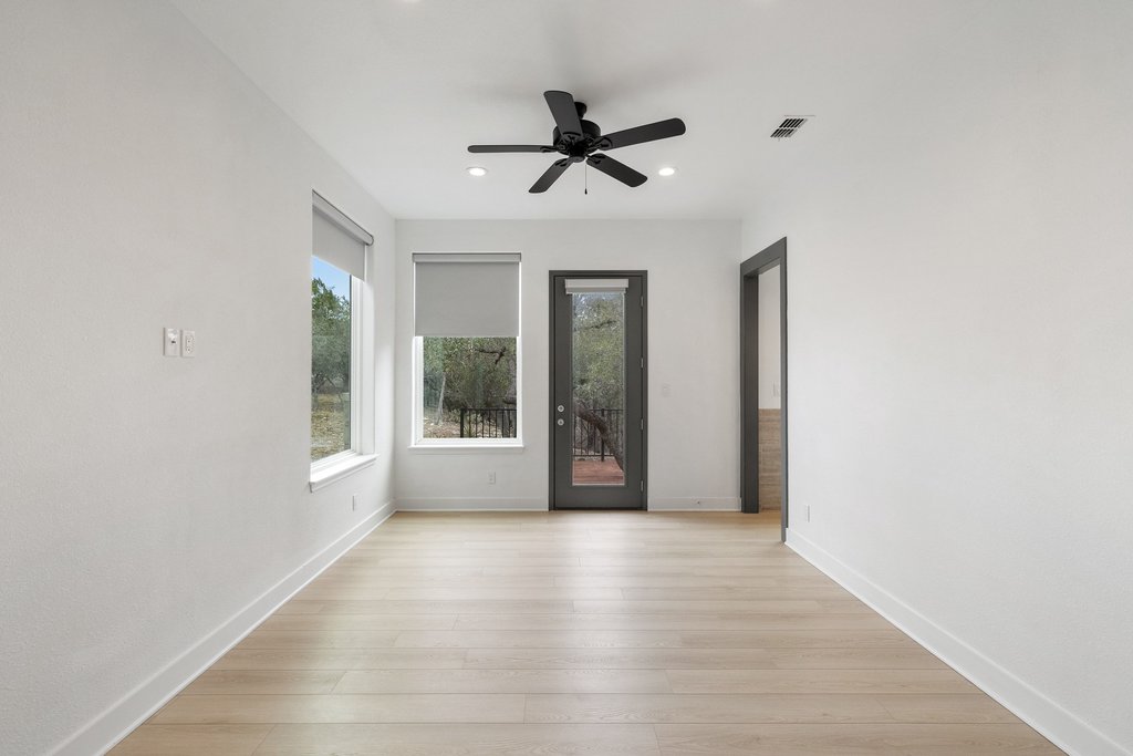 4018 Bee Creek Road Spicewood, TX 78669 - Photo 38 of 40 Guest house primary bedroom with private access to outdoor deck and outdoor shower.