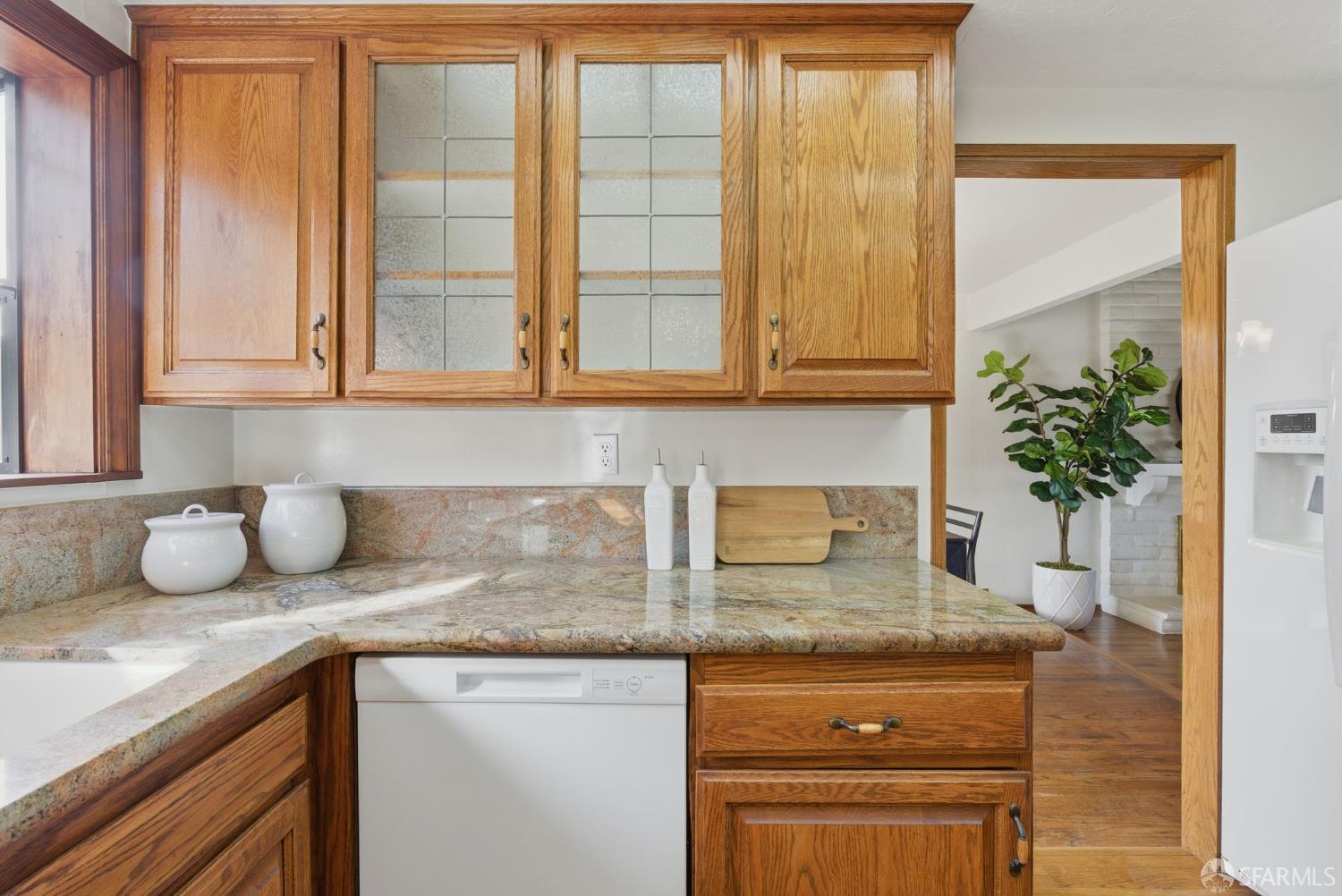 969 Springfield Drive Millbrae, CA 94030 - Photo 11 of 48 a kitchen with granite countertop a sink and a window
