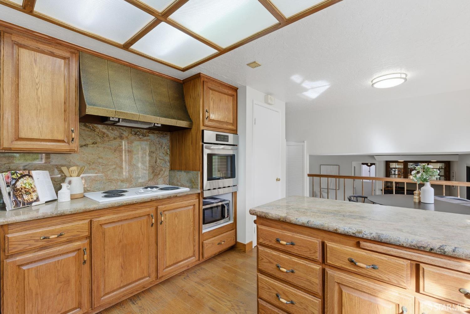 969 Springfield Drive Millbrae, CA 94030 - Photo 12 of 48 a kitchen with a sink and cabinets