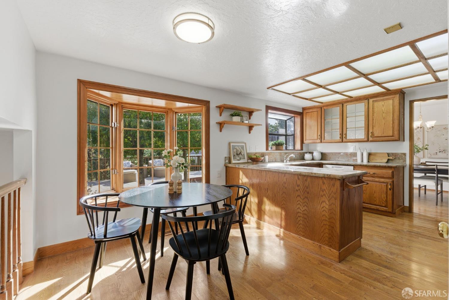 969 Springfield Drive Millbrae, CA 94030 - Photo 15 of 48 a view of a dining room with furniture window and wooden floor