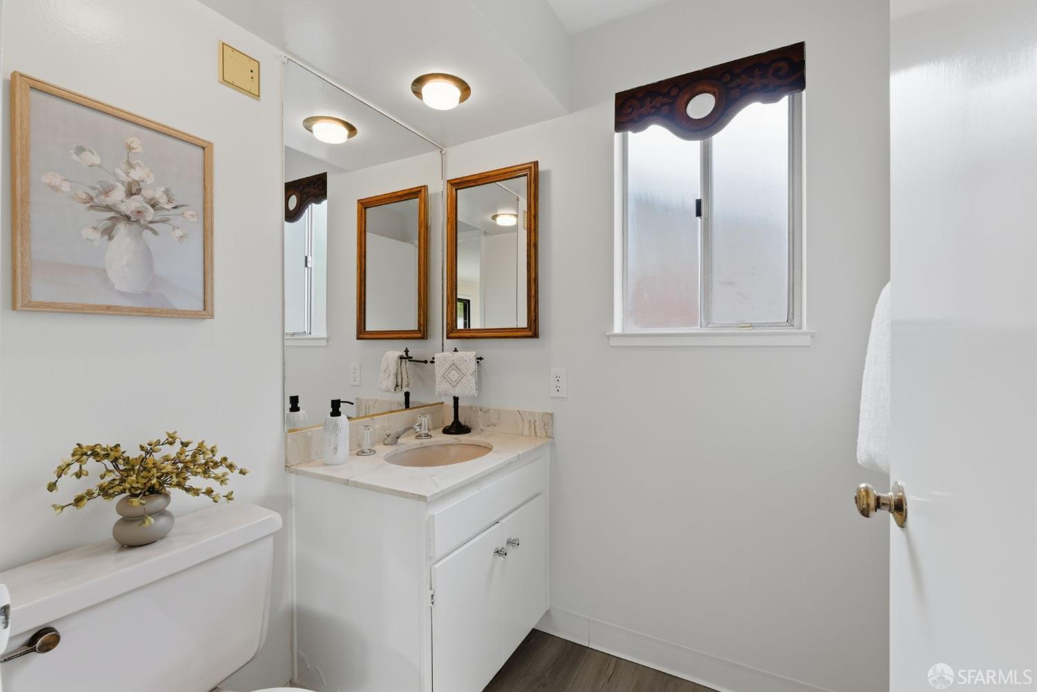 969 Springfield Drive Millbrae, CA 94030 - Photo 20 of 48 a bathroom with a sink mirror and vanity