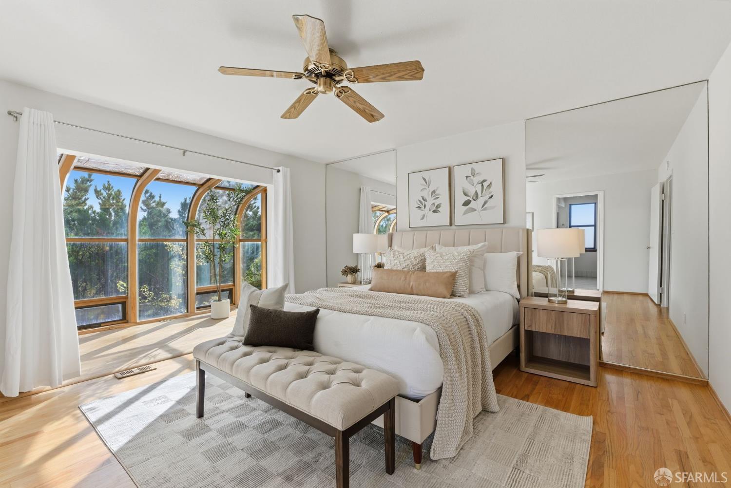 969 Springfield Drive Millbrae, CA 94030 - Photo 23 of 48 a spacious bedroom with a bed a couch and a window