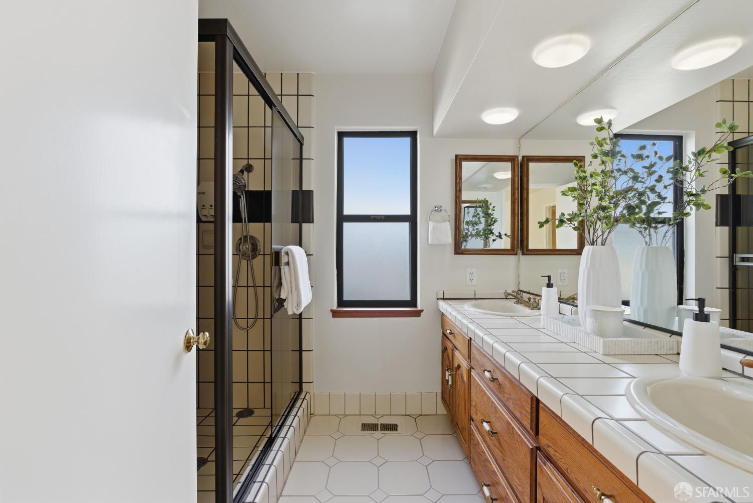 969 Springfield Drive Millbrae, CA 94030 - Photo 26 of 48 a bathroom with a granite countertop sink a mirror and shower