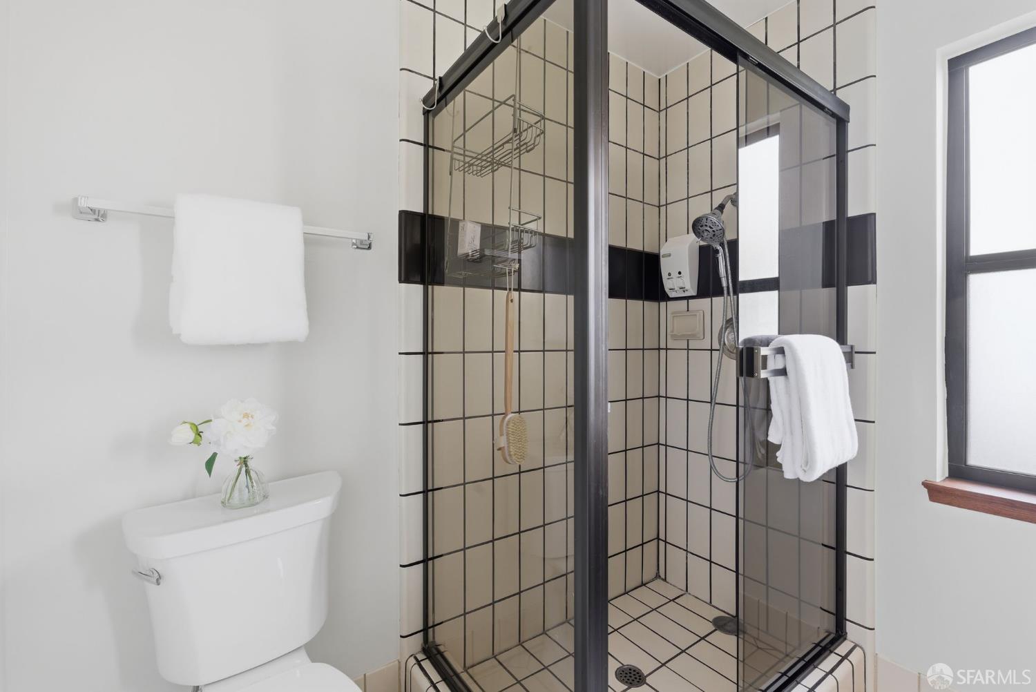 969 Springfield Drive Millbrae, CA 94030 - Photo 27 of 48 a bathroom with a sink toilet and shower