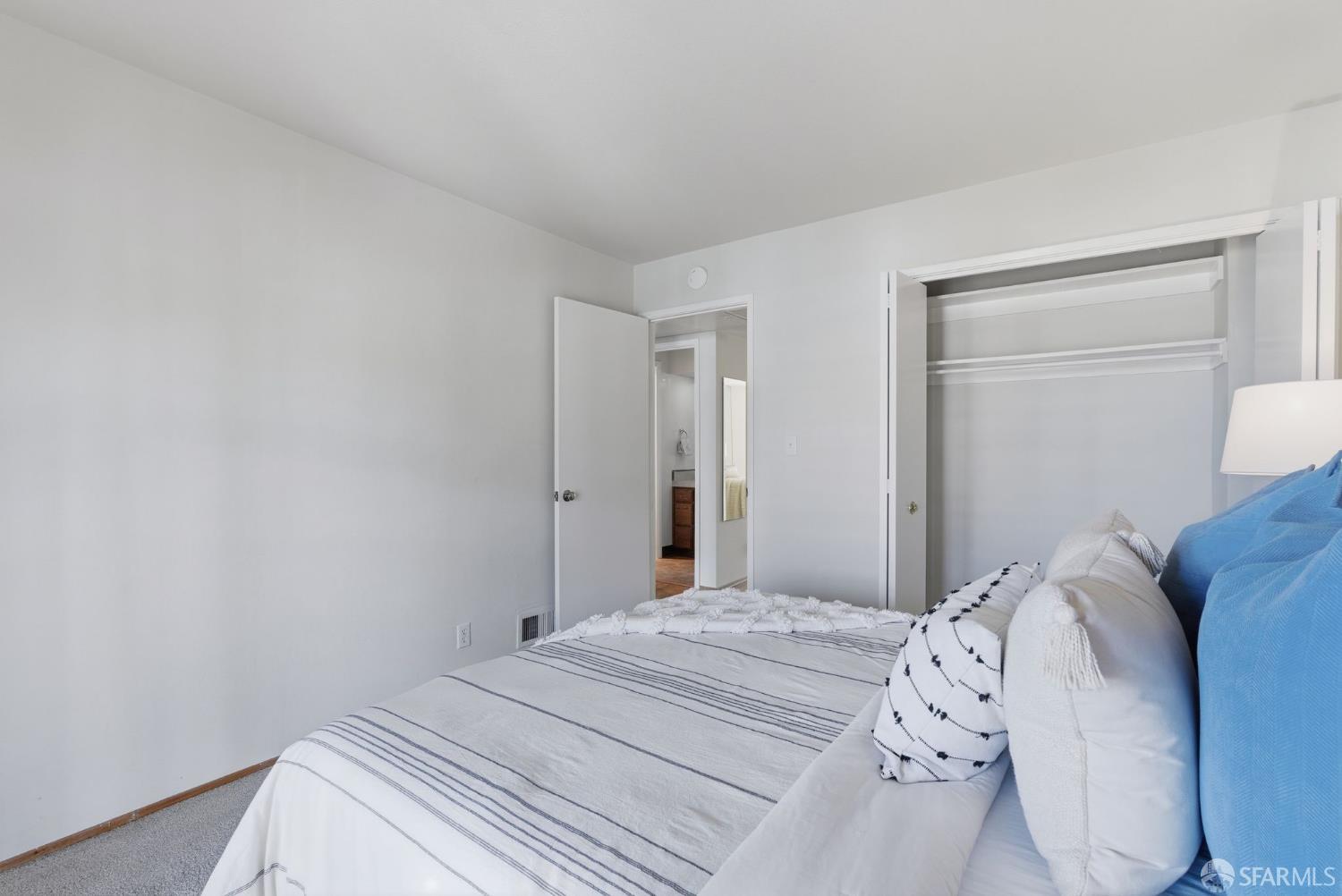 969 Springfield Drive Millbrae, CA 94030 - Photo 31 of 48 a bedroom with a bed and a lamp