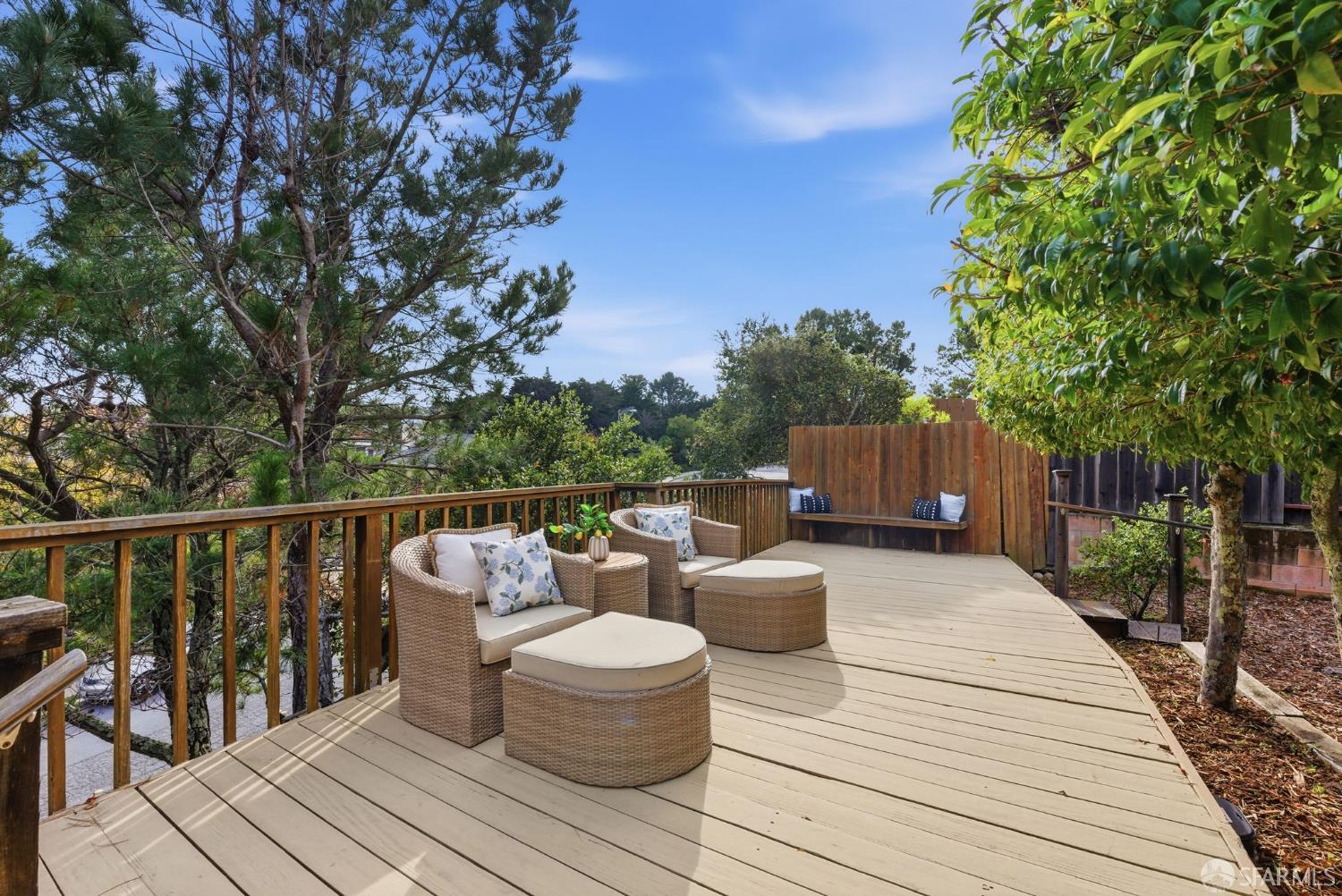 969 Springfield Drive Millbrae, CA 94030 - Photo 42 of 48 a balcony with wooden floor and outdoor seating